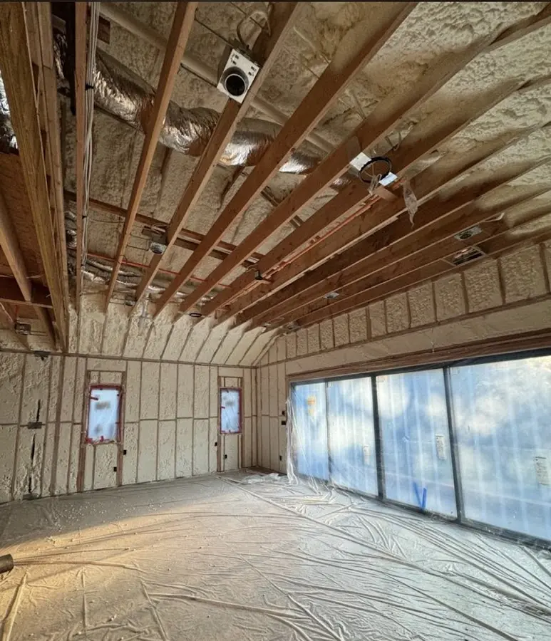 Interior walls and ceiling insulated with spray foam during new construction in Wanaque